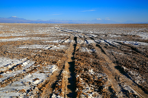 Rustic dirt country road to Salar de atacama – salt flat stones, rock formation,  Atacama Desert altiplano, volcanic landscape panorama – San Pedro de Atacama, Chile, Bolívia and Argentina border