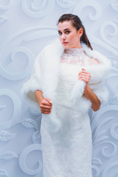istock Fashion model posing in white dress 807920512