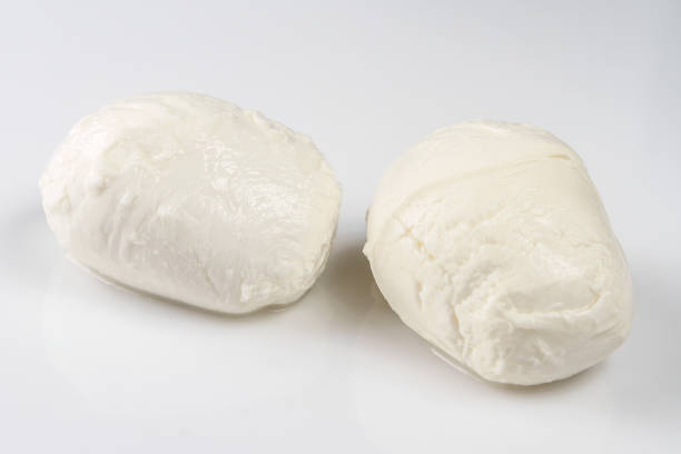 istock ingredient for Caprese salad. Two mozzarella cheese balls. Isolated on white background 807922966