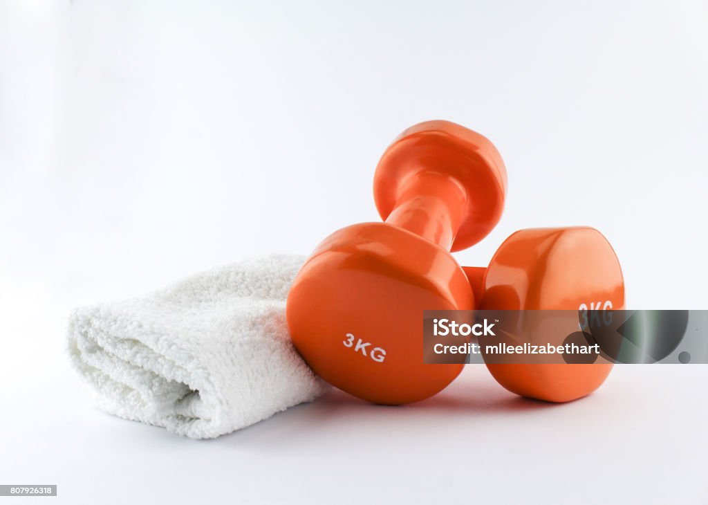 A pair of hand weights and towel. Isolated on white, clipping path White Background Stock Photo