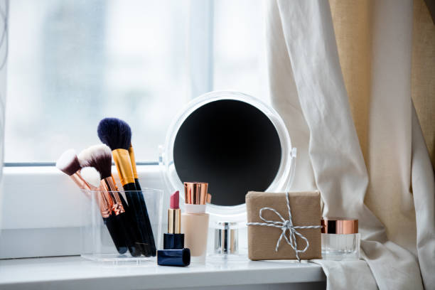 istock professional makeup set, gift and cute mirror on the wonderful white windowsill 807953424