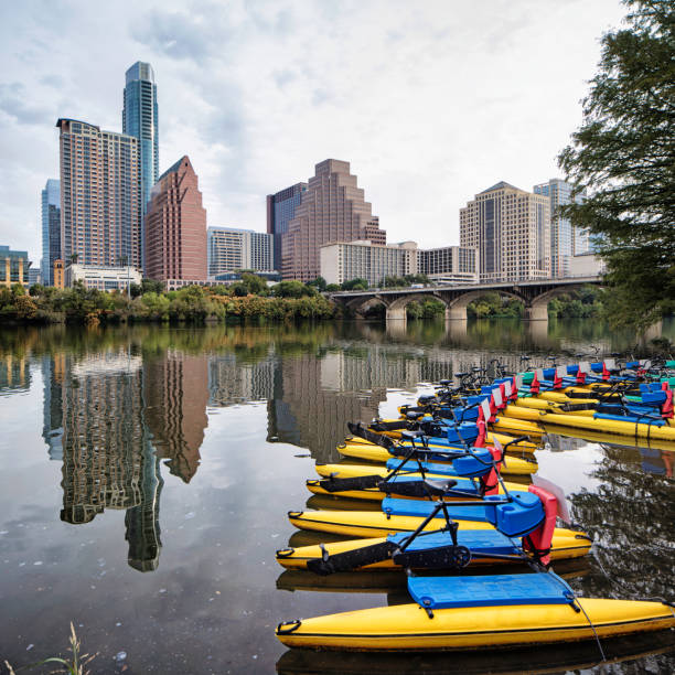 istock Downtown Austin panoramic skyline from Colorado River with parked water bikes 807954114