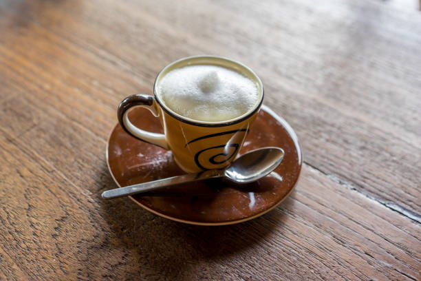 istock hot cappuchino coffee on wooden table 807967424