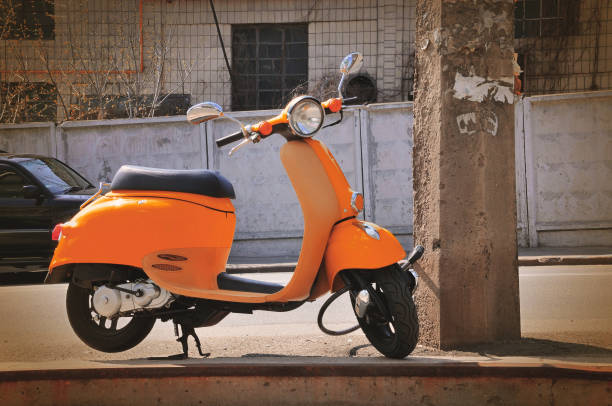 istock yellow moped in city 807967616