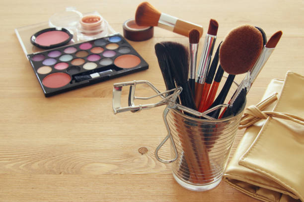 istock makeup cosmetics beauty tools and brushes on wooden background 807983180