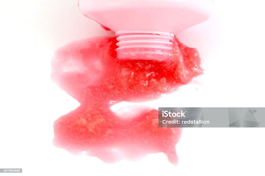 chewing gum flows out from tube on white chewing gum with strawberry flavor flows out from tube on white Bubble Gum Stock Photo