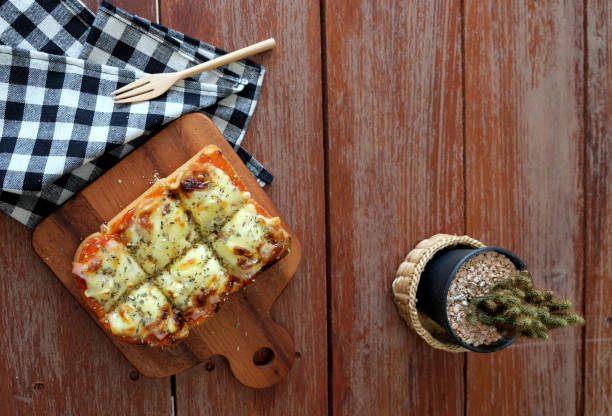 istock Pizza toasted bread with tomato sauce and ham cheese selective focus, picture vintage style 807989312