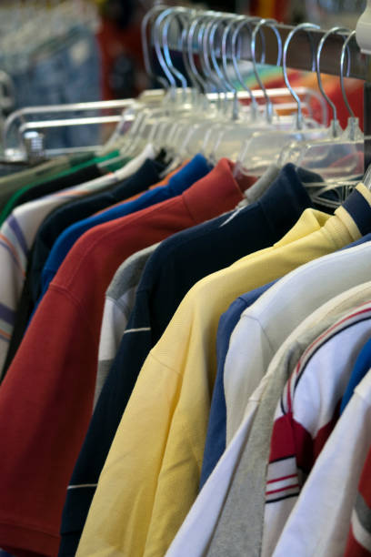 istock Clothing hanging on a rack in a store 807989368