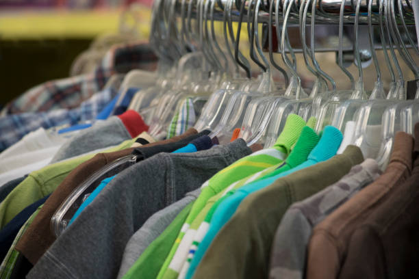 istock Clothing hanging on a rack in a store 807989560