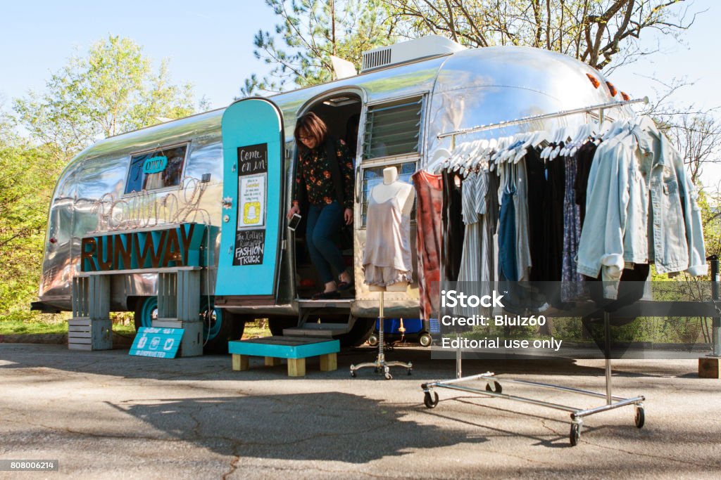 Woman Emerges From Mobile Clothing Store At Atlanta Festival Stock
