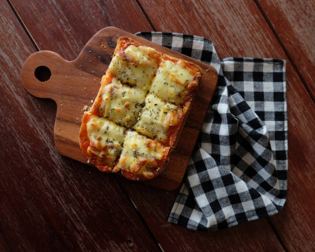 istock Pizza toasted bread with tomato sauce and ham cheese selective focus, picture vintage style 808007154