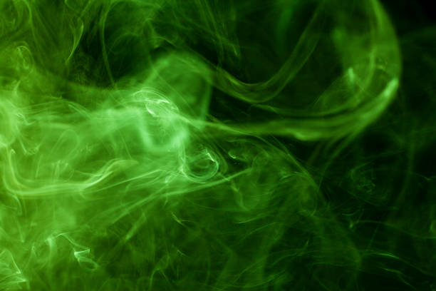 istock Green smoke movement on black background. 808012932