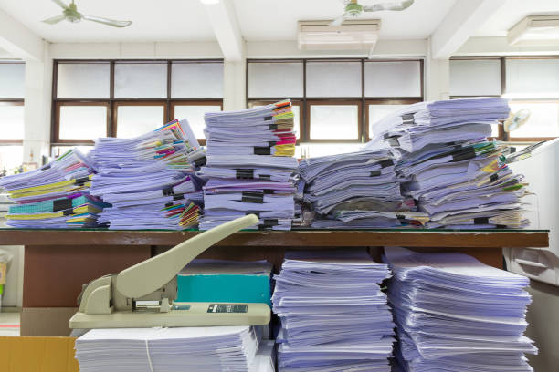 istock Pile of unfinished documents on office desk, Stack of business paper 808019770