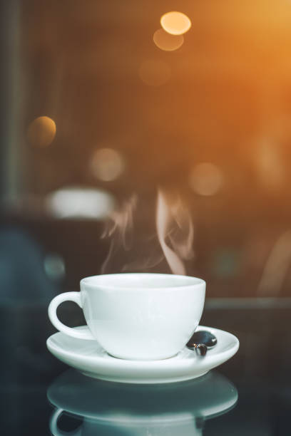 istock cup of coffee and smoke on table in cafe. 808053146