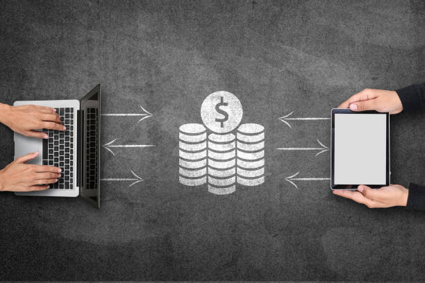 istock Digital tablet and laptop with financial concept on blackboard 808070446