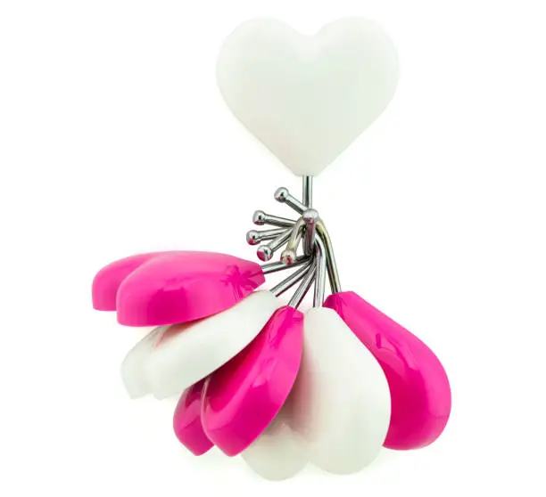 Photo of White heart magnet hook hanging white and pink hearts isolated on white, business concept as leadership