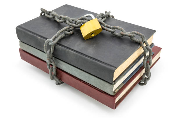 istock Top secret information concept, old books with chain and padlock isolated on white background 808079078