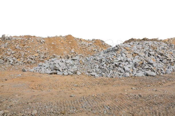 Pieces of concrete and brick rubble debris on construction site isolated on white background