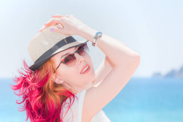 Red Head Woman At Alanya for Vacation and She is posing in front of the Mediterranean Sea