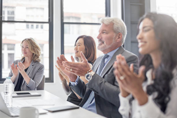 istock Business people applauding in board room 808093654