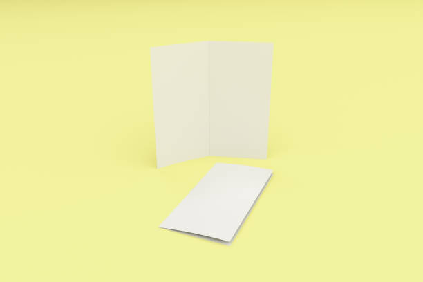 istock Blank white two fold brochure mockup on yellow background 808093922