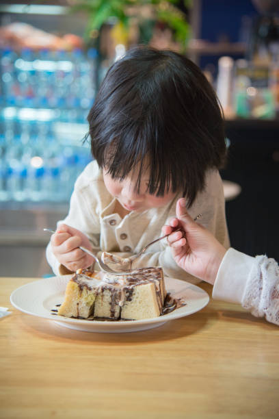 istock Asian boy eating honey toast 808096362