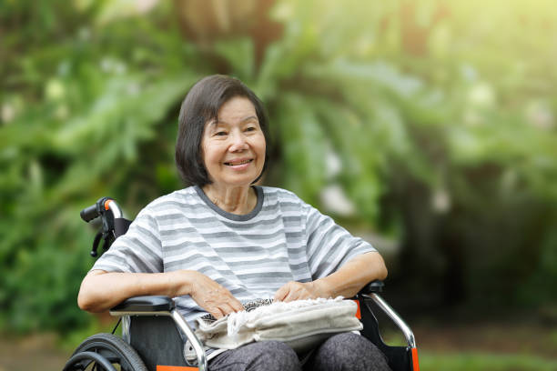 istock smiling elderly woman ,sitting on wheelchair 808096888