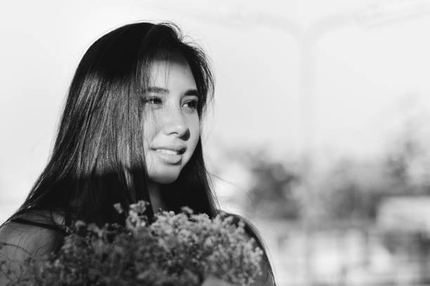 istock Young Woman Smiling Flowers Concept 808096914
