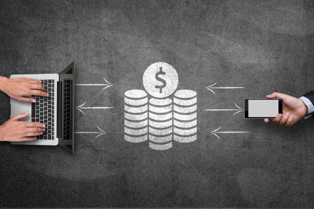 istock Mobile phone and laptop with financial concept on blackboard 808101742