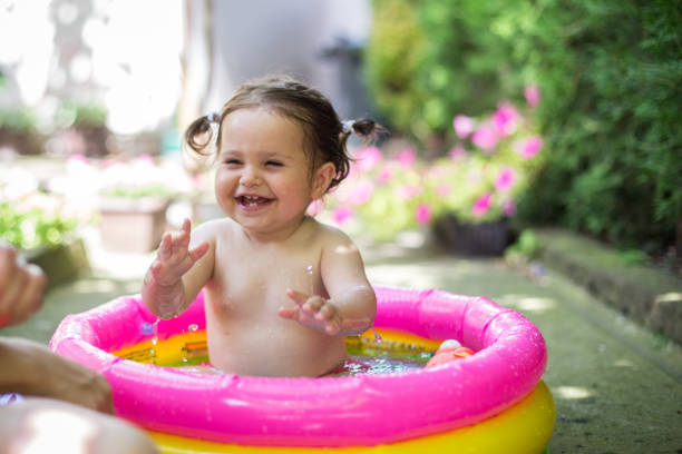istock Baby girl in water 808102648