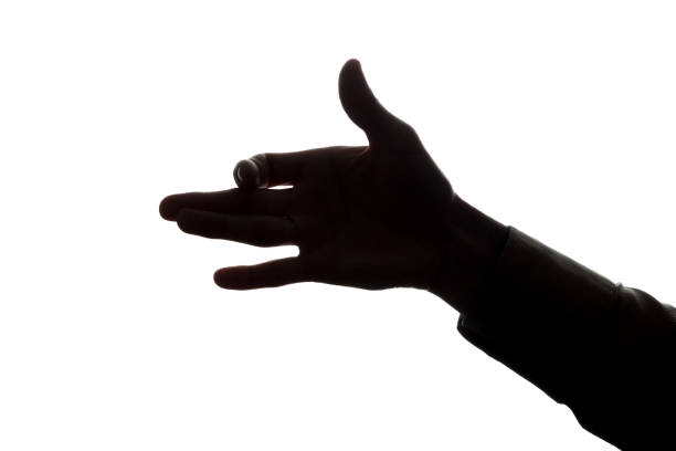 istock Man's hand shows symbol dog - silhouette 808102996