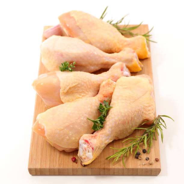 istock raw chicken leg isolated on white 808105868