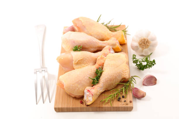 istock raw chicken leg isolated on white 808105924