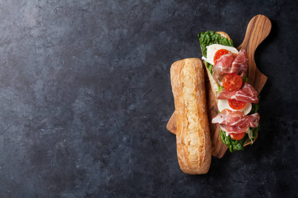 istock Sandwich with salad, prosciutto and mozzarella 808106134