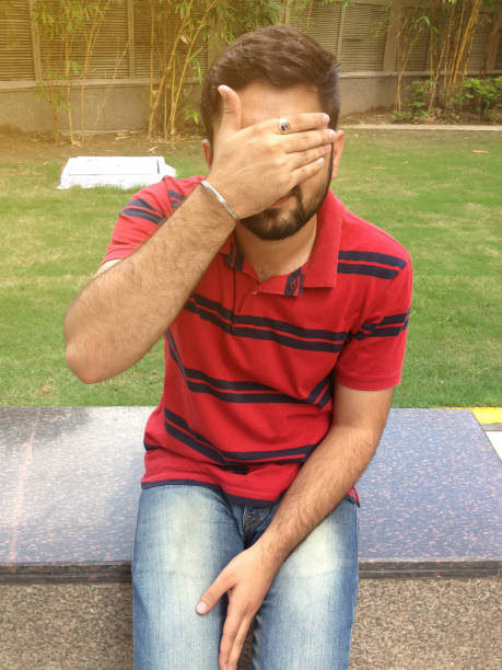 istock Man Covering Eyes And Face 808109150