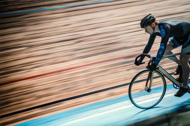 Athlete Racing cyclist on velodrome velodrome stock pictures, royalty-free photos & images
