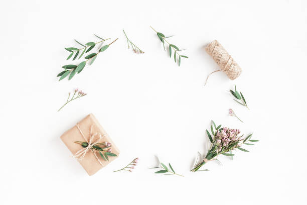 istock Gifts, pink flowers and eucalyptus branches. Flat lay, top view 808119982