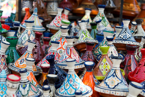 selection of tagine pottery on market in morocco