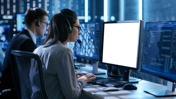istock Close up Shot of Female working in a Technical Support Team Gives Instructions with the Help of the Headsets. She Works With White Screen Isolated. Good for Template. 808157510