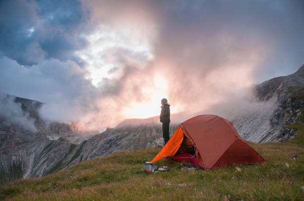 istock Wil Camping Cooking Sunset Female 808157820