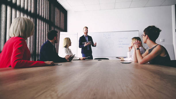 istock Business man presenting new ideas and projects to his team 808158436
