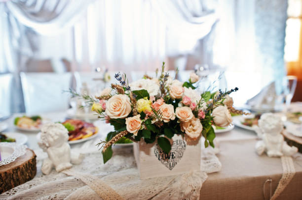 istock Fantastic flower compositions laying on a wedding table. 808165330