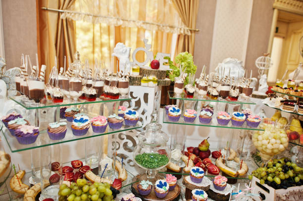 istock Gorgeous-looking wedding table with various beverages, delicious dishes, fruits and decorations. 808169042