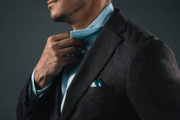 istock partial view of man holding shirt collar isolated on grey 808180660