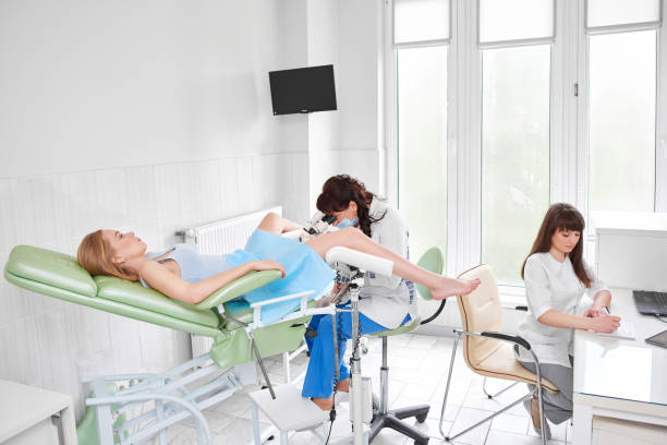 istock Professional gynecologist examining her patient 808186196