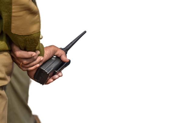 Portable walkie-talkie radio in hand on whitr background