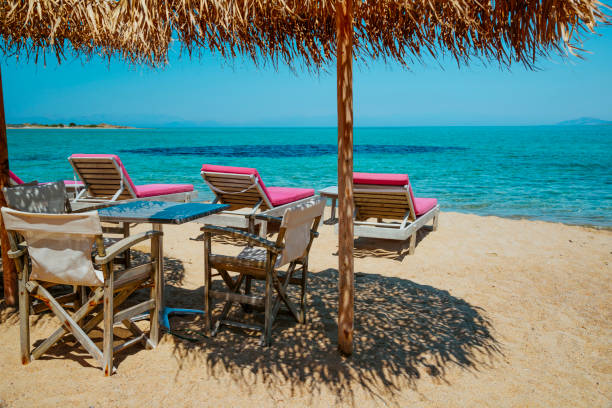 istock Beach chairs with umbrella and beautiful sand beach 808210748