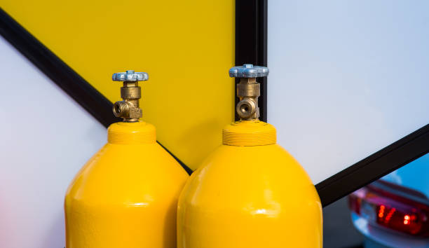 yellow LPG gas bottles stock photo