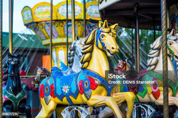 Beautiful Horse Christmas Carousel In A Holiday Park Horses On A Traditional Fairground Vintage Carousel Merrygoround With Horses Stock Photo - Download Image Now