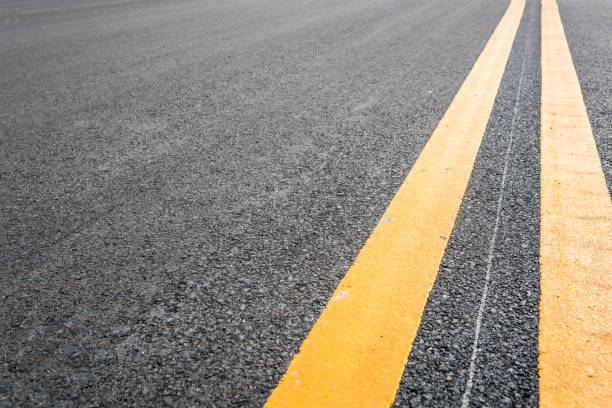 istock Asphalt road with yellow double line 808333240